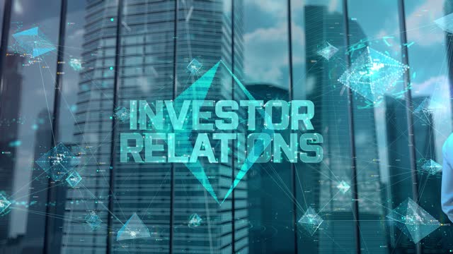 Investor Relations. Businessman Working in Office among Skyscrapers. Hologram Concept