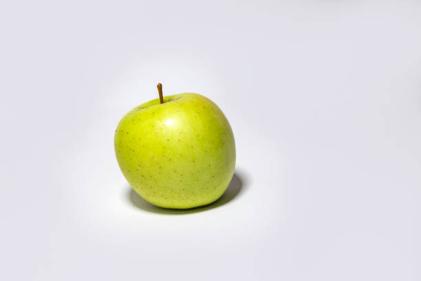 Green yellow apple on white background isolated