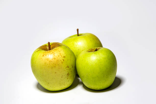 istock Green yellow apples on white background isolated 1705774448