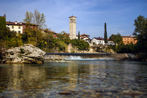 Natisone river and the church of San Pietro and San Biagio in Cividale del Friuli, Italy.