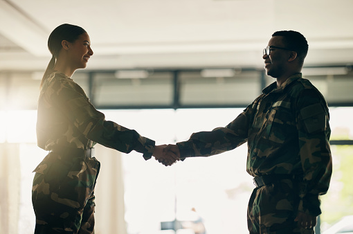 Meeting, army or soldiers shaking hands for partnership, teamwork or deal in war agreement together. People, promotion or handshake for team fight, thank you or gratitude in solidarity or military