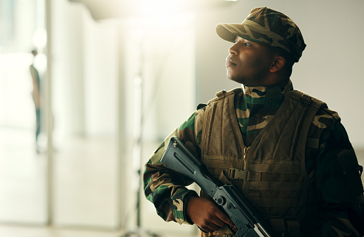 Thinking, soldier and black man with gun in army, vision and serious in security. Military veteran, rifle and weapon of African professional with idea in camouflage uniform at government agency.