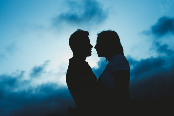 istock Backlight of a couple kissing 1705804192