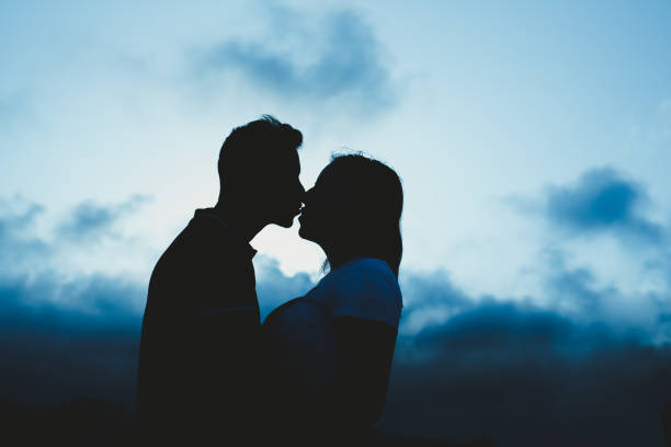 istock Backlight of a couple kissing 1705804204