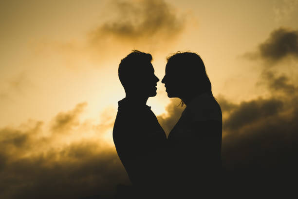 istock Backlight of a couple kissing 1705804216