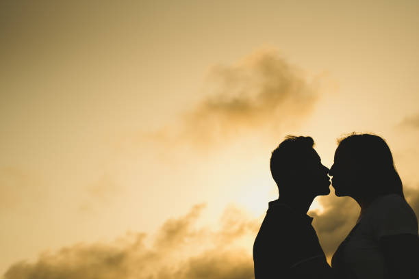 istock Backlight of a couple kissing 1705804231