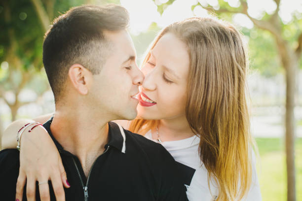 istock Couple strolling calmly on the warm beach 1705804336