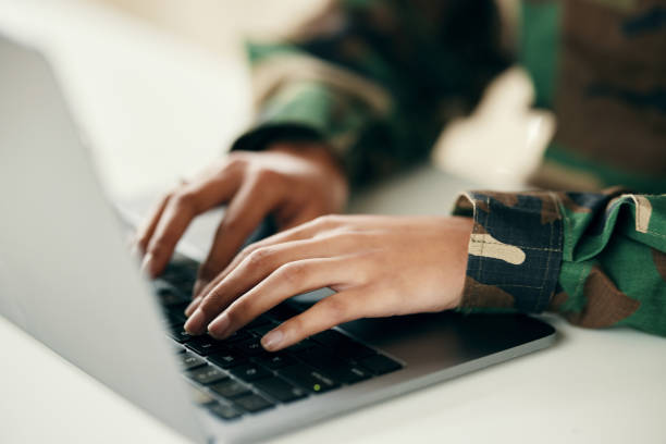 istock Military command center, hands or soldier on computer for analysis and technology for cyber intelligence. Security, email communication or guard typing on pc in army office at government control room 1705805720
