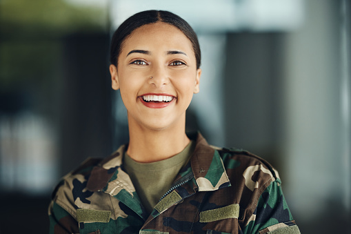Happy, portrait and a woman in the army for service, war training or soldier in clothes. Smile, security and a female military veteran or girl in gear or uniform for battle, trust or in the navy