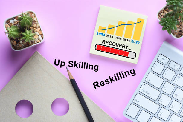 Business recovery loading with economic growth graph on sticky note and keyboard on desk