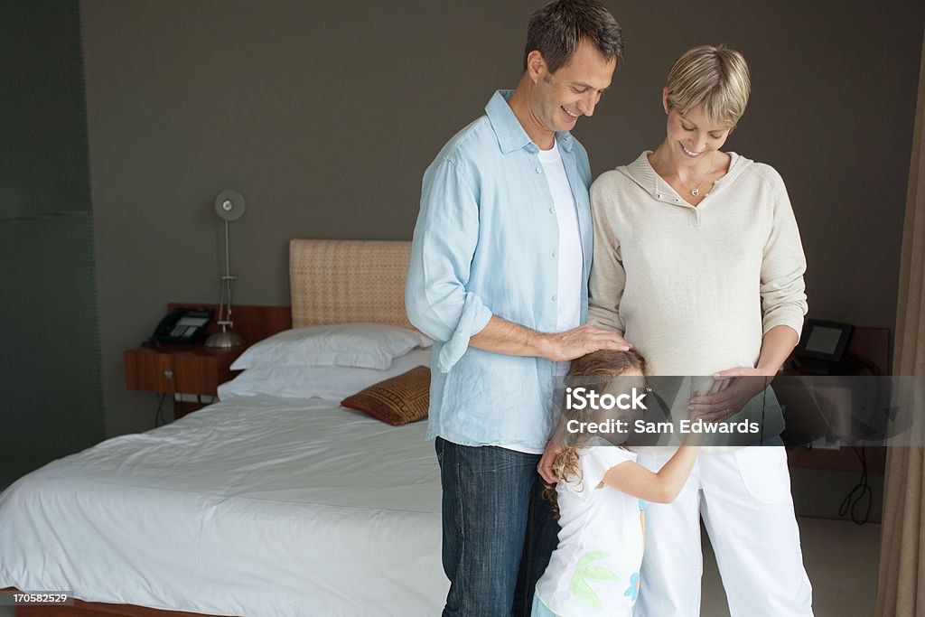 Father, mother and daughter smiling  30-34 Years Stock Photo