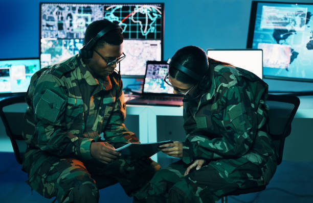 istock Military control room, tablet or team monitor CCTV, army database server or online surveillance system. Data center, soldier collaboration or people teamwork on crime report, safety or security intel 1705832704