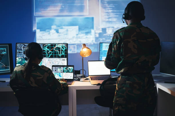 istock Control room, military and people on computer for surveillance, tracking operation and national security. Army, government and soldiers online for cybersecurity, communication network and monitoring 1705832732
