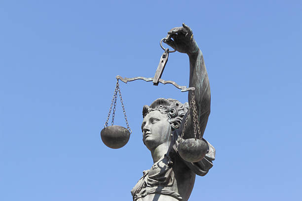 istock perfect blue sky behind ancient lady Justice Justitia 170583562