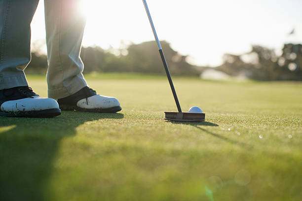 Man putting golf ball  putting golf stock pictures, royalty-free photos & images