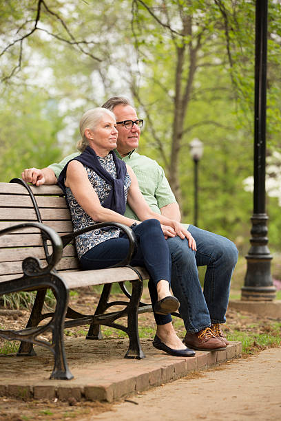 istock Couple sitting in the park 170587989