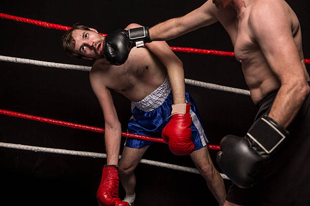 istock Young Man Tangled Up In Boxing Ring Ropes 170588021