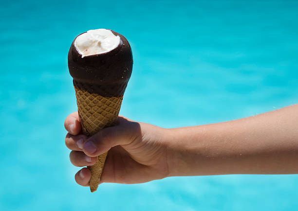 istock Ice cream in a child's hand close-up 170588063