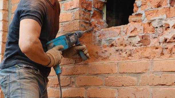 istock knocking out a window opening with a pneumatic drill 1705896398