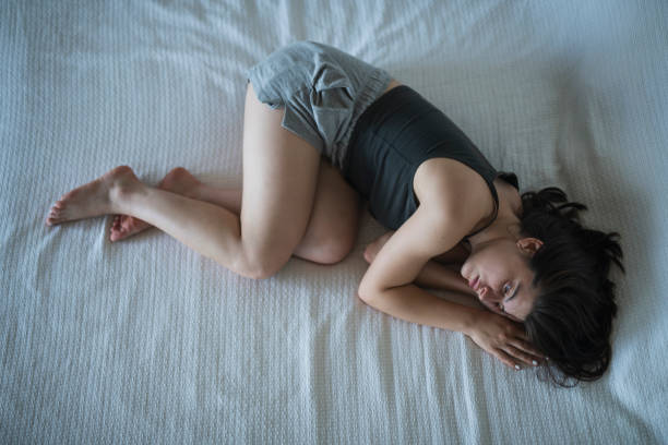 istock Deeply depressed teen in her bed at home. 1705907050