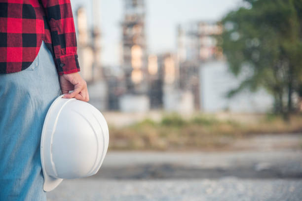 istock Woman construction engineer wear safety white hard hat at construction site industry worker. Female engineer worker civil engineering with hard hat safety helmet. Woman construction Engineer concept 1705908739