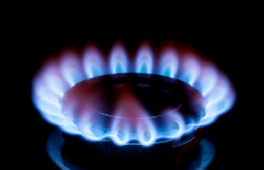 Close up of a lit gas burner.  Motion visible in flames.