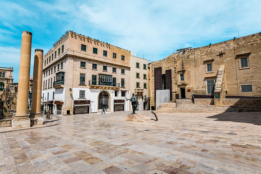 People near Palazzo Ferreria and Pjazza Teatru Rjal in Valletta, Malta