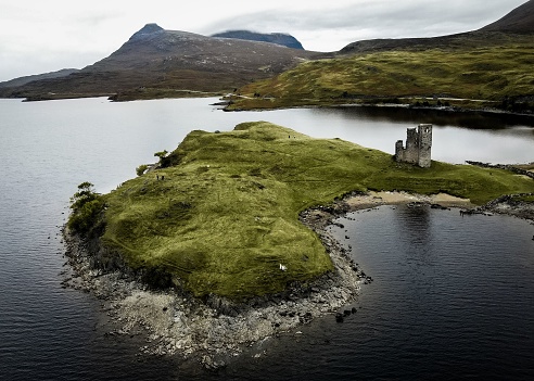 An aerial view of Ardvreck Castle, an iconic landmark in Scotland