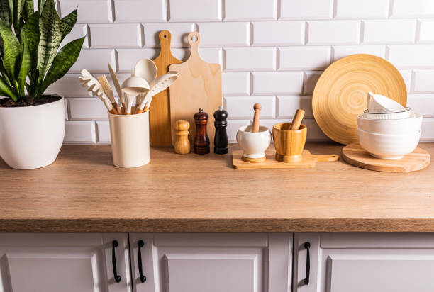 istock A set of various kitchen tools, utensils made of environmentally friendly materials on the kitchen countertop, a white brick wall. Eco-interior. 1705942051