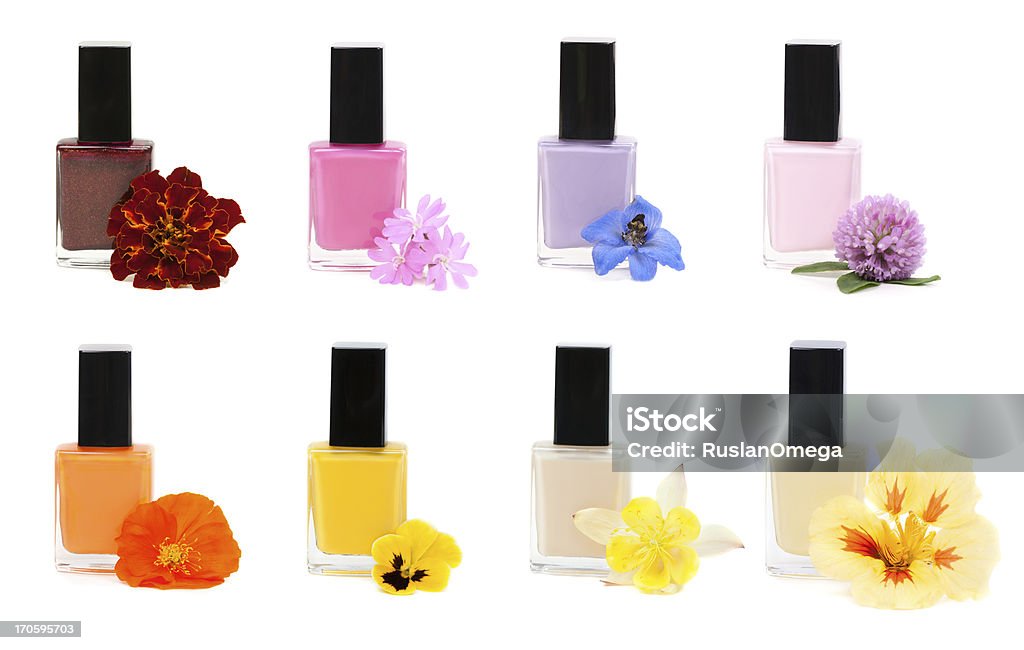 Collage Nail polish with flower Eight bottles of nail polish with flowers on a white background. Beauty Stock Photo