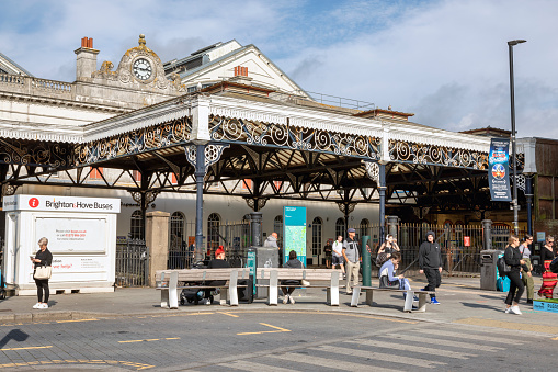 Brighton, United Kingdom - Sep 26, 2023: Brighton & Hove Railway Station in East Sussex, England, with people in the background