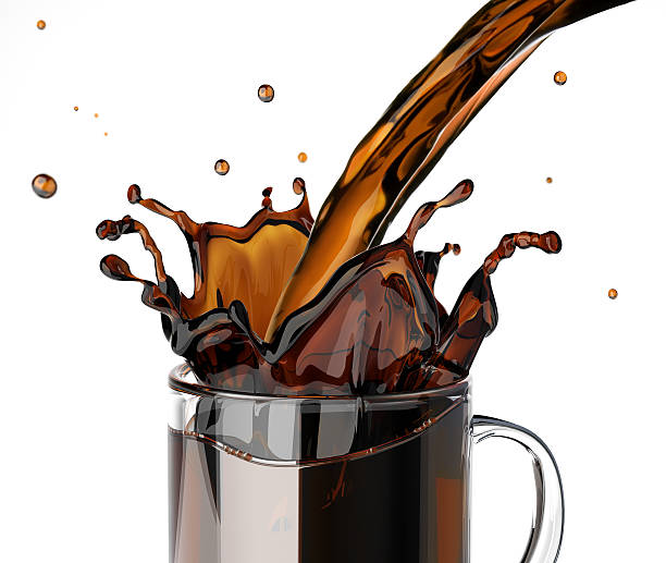 Pouring coffee splashing into a glass mug, at white background.