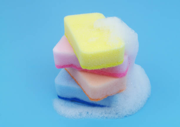 istock Many different sponges with foam on blue background. 1705962222
