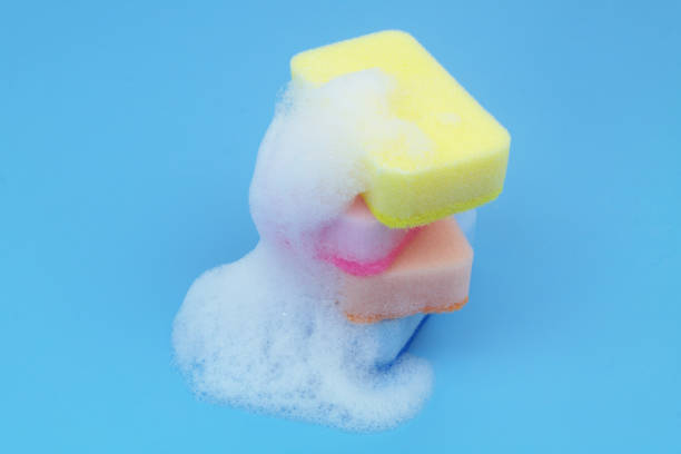 istock Many different sponges with foam on blue background. 1705962227