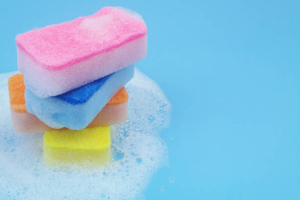 istock Many different sponges with foam on blue background. 1705962327