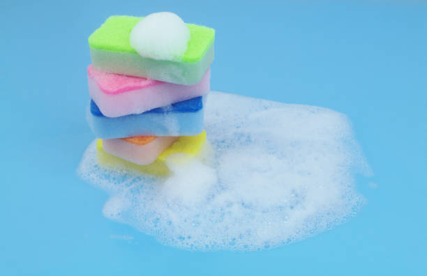 istock Many different sponges with foam on blue background. 1705962667