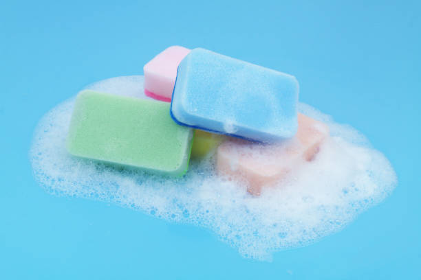 istock Many different sponges with foam on blue background. 1705962863
