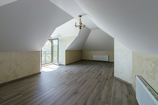 Indoor view of an empty attic of a new modern house.