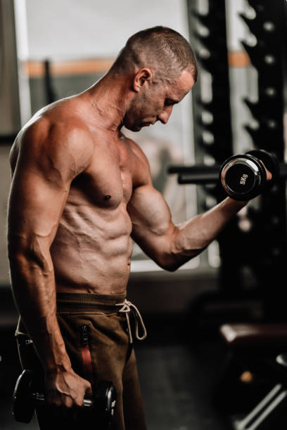 istock Bicep Pump By Male Bodybuilder 1705966465