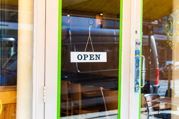 istock Open sign hanging in shop window 1705969808