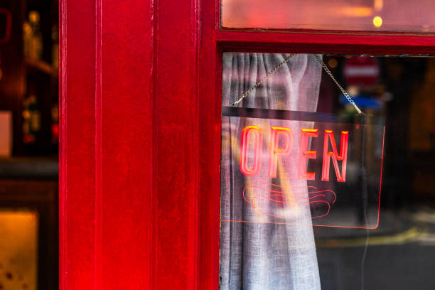 istock Open sign hanging in shop window 1705970357