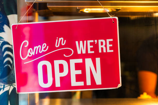 istock Open sign hanging in shop window 1705970923