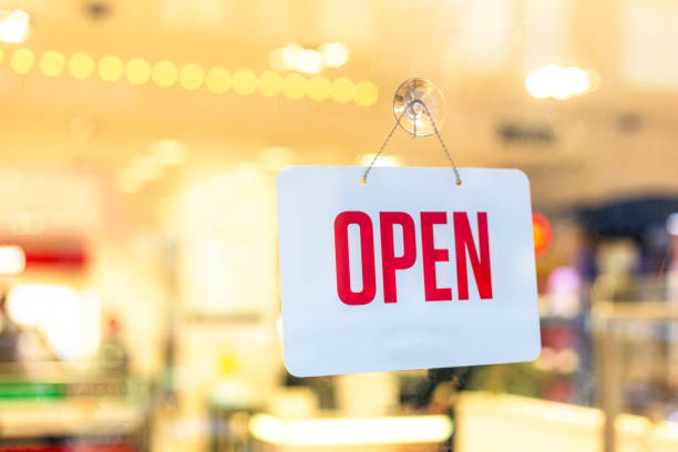 istock Open sign hanging in shop window 1705970986
