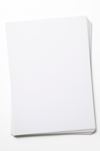 High angle view of stacked blank paper isolated on white background with clipping path.