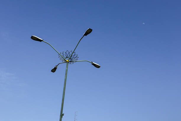 istock Automatic street lamp pole with solar panel system over the clear blue sky background 1705973371
