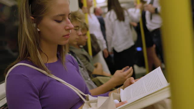 Teenagers travelling in London  train