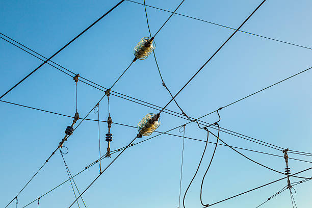 istock Railroad overhead lines against clear blue sky 170598343