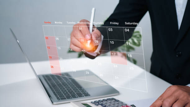 istock Businessman marking dates on virtual calendar, managing his business schedule, setting reminders for important appointments, creative collage for planning ideas, appointment scheduler 1706008082