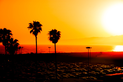 Vacation Travel:  Sunset over Santa Monica Beach and parking lot