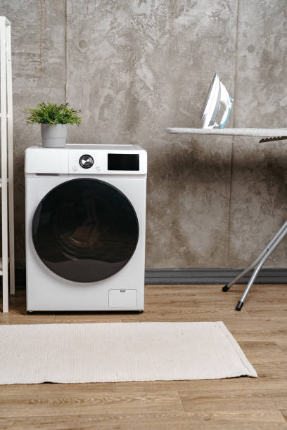 istock Washing machine in a gray modern laundry room 1706027271